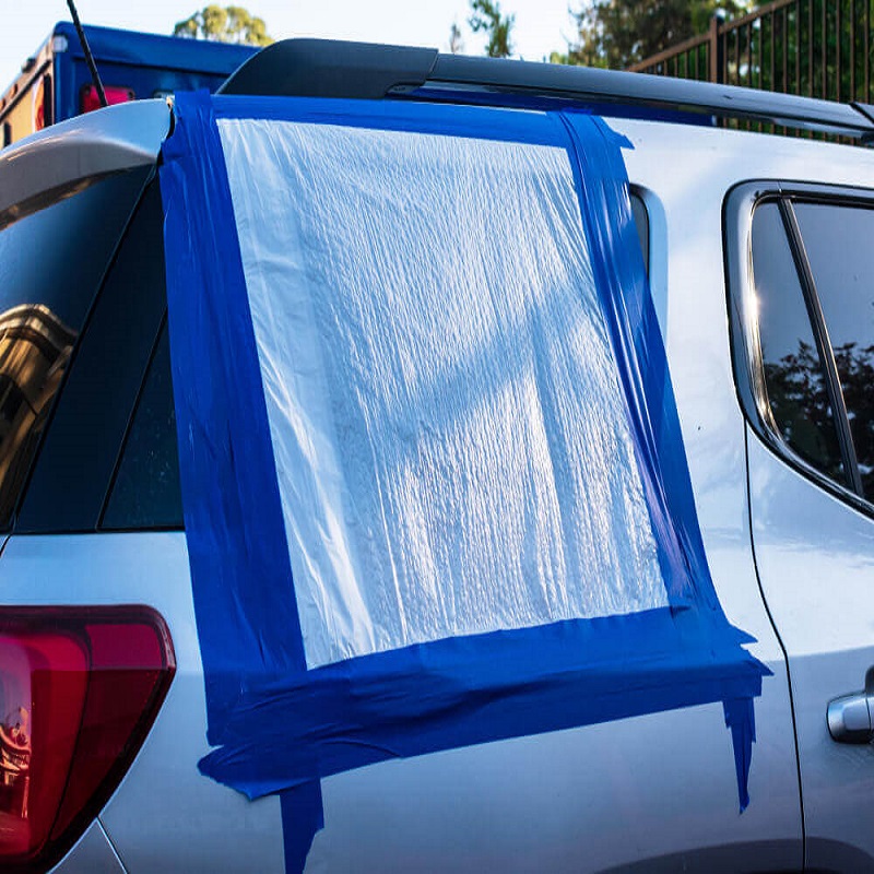 cover a broken car window from rain